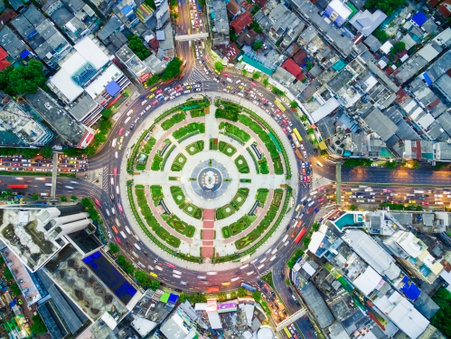 Aerial view of roundabout with traffic in urban environment