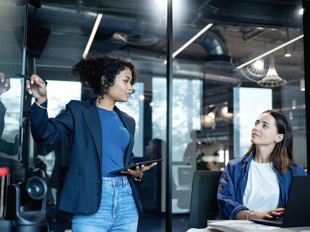 Positioning based on price, quality, innovation in your brand with product positioning strategies. A team of product and market development on a market strategy meeting to determine target group and market channel in a modern office.